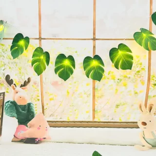 Guirlande lumineuse en feuilles de Monstera artificielles